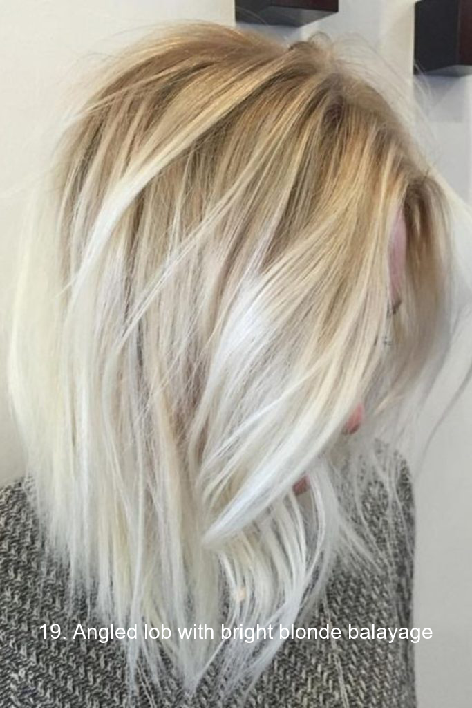 19. Angled lob with bright blonde balayage
