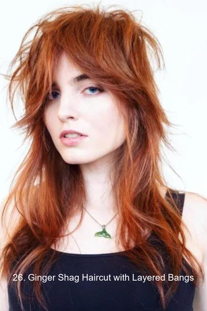 26. Ginger Shag Haircut with Layered Bangs
